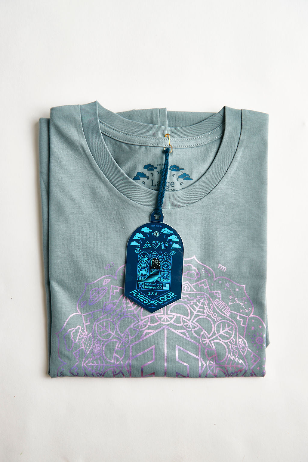Buy Holographic / Iridescent Foil FOREST FLOOR Mandala Logo™ on 100% Cotton Premium T-Shirt