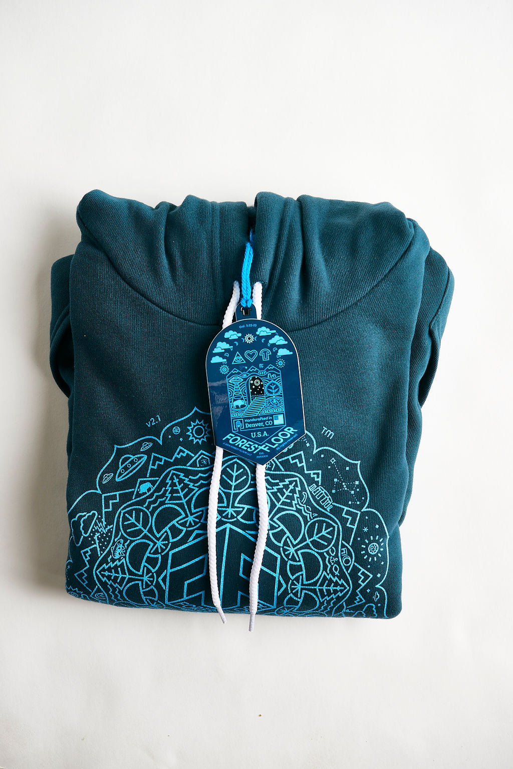 Buy Men's / Unisex Psilocybin Blue™ Glow-in-the-Dark FOREST FLOOR Mandala Logo™ on Sponge Fleece Hooded Sweatshirt