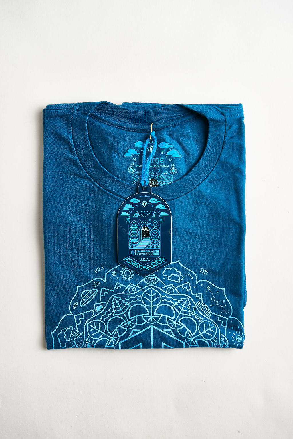 Psilocybin Blue™ Glow-in-the-Dark FOREST FLOOR Mandala Logo™ on 100% Cotton Tee