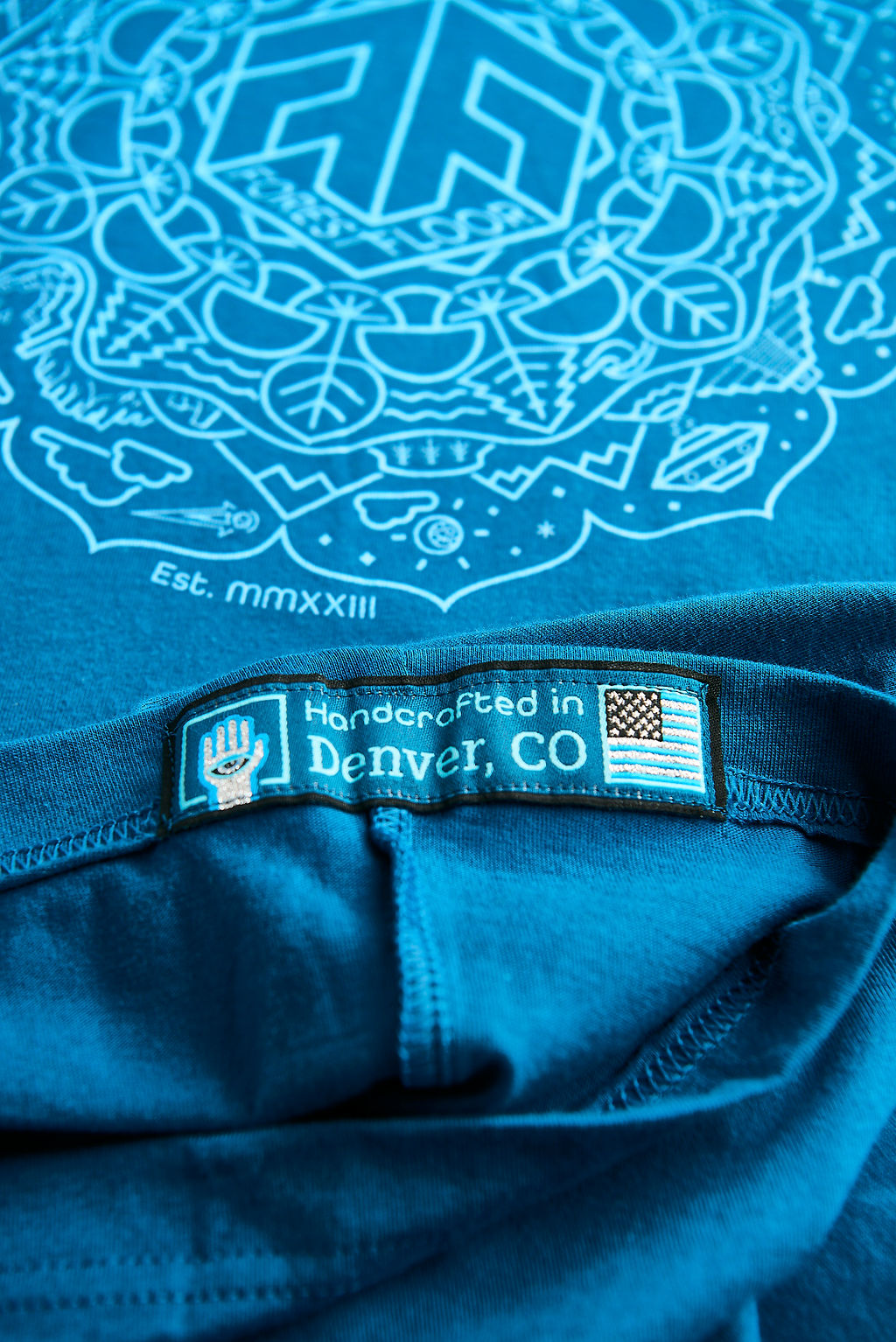 Psilocybin Blue™ Glow-in-the-Dark FOREST FLOOR Mandala Logo™ on 100% Cotton Tee