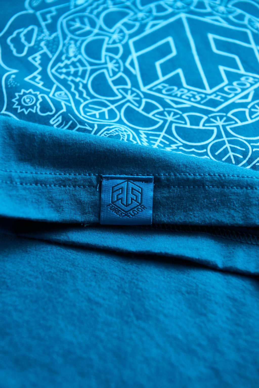 Psilocybin Blue™ Glow-in-the-Dark FOREST FLOOR Mandala Logo™ on 100% Cotton Tee