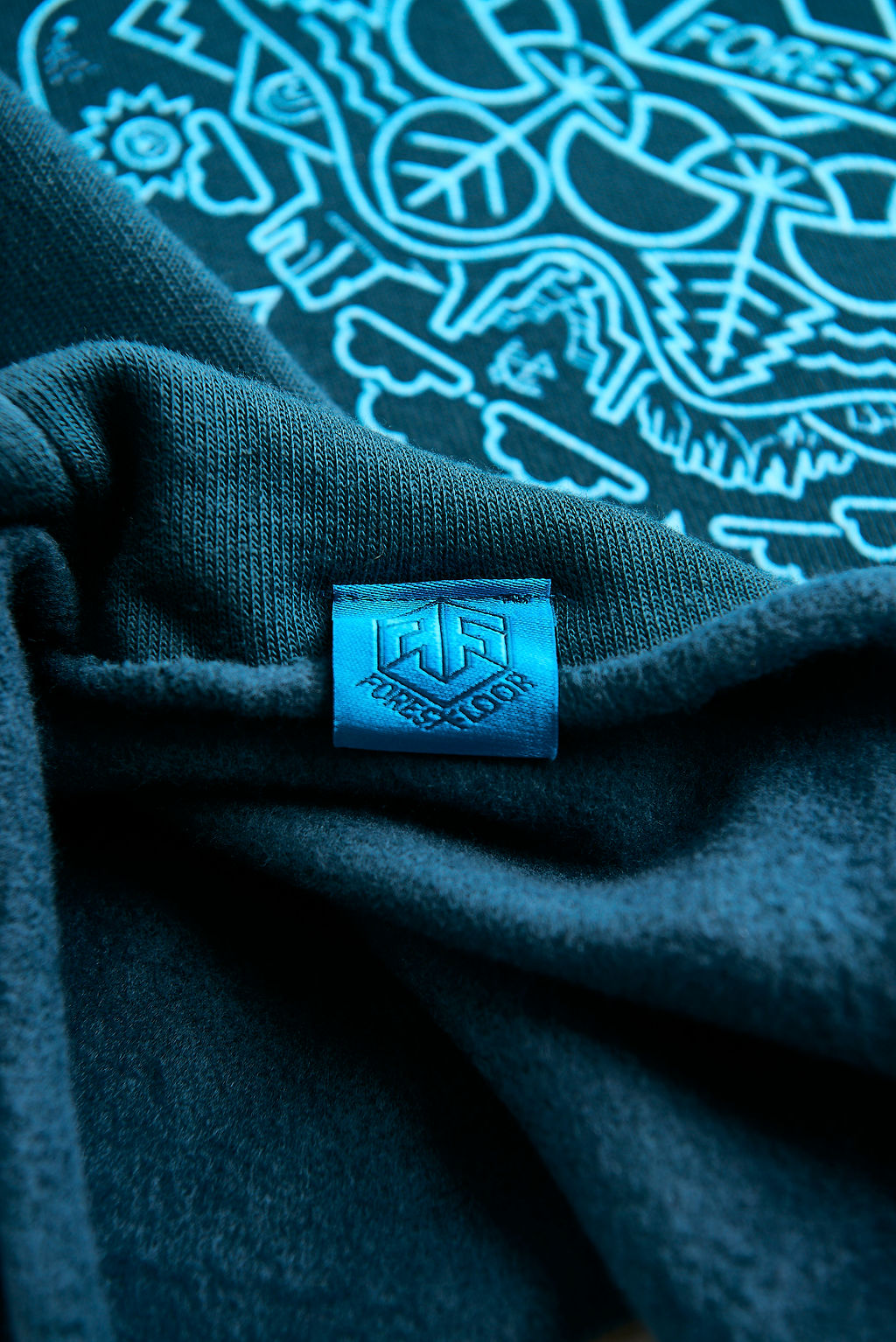 Women's Psilocybin Blue™ Glow-in-the-Dark FOREST FLOOR Mandala Logo™ on Cropped Sponge Fleece Hooded Sweatshirt